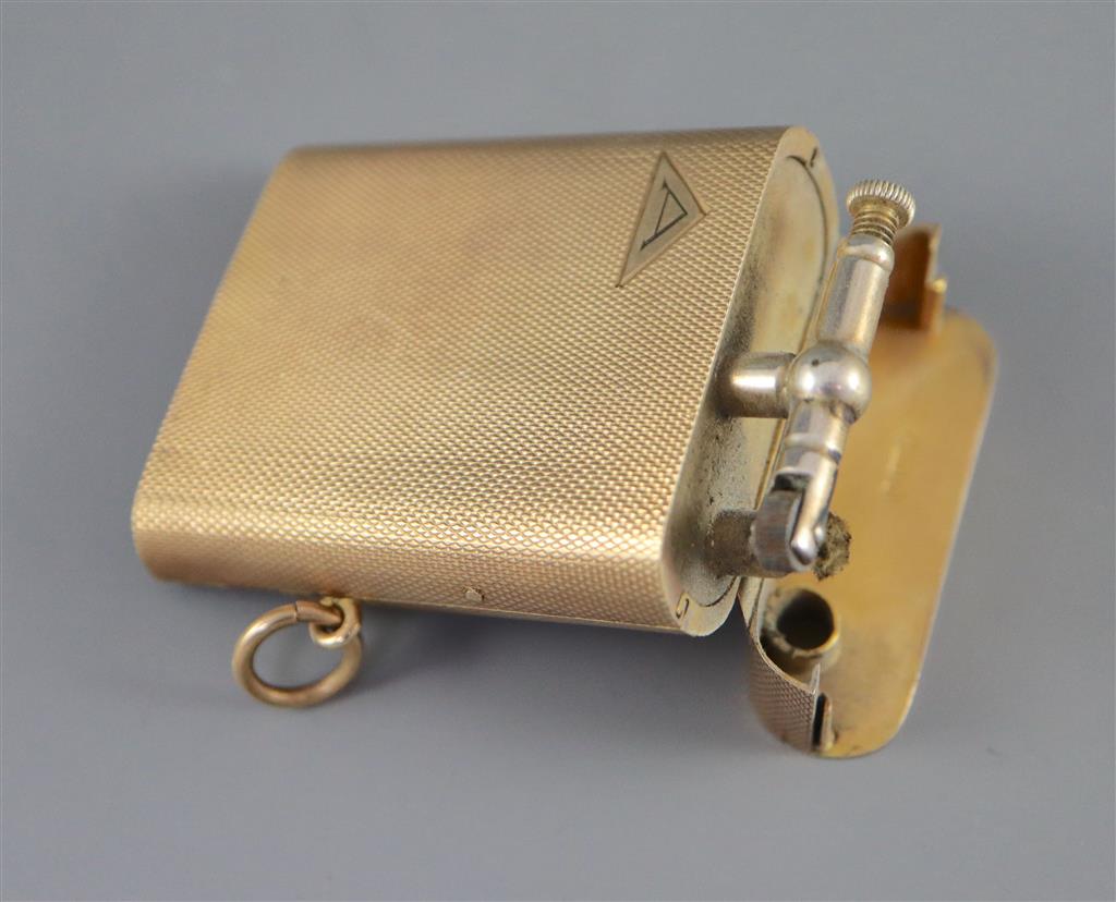 A 1920s engined turned 9ct gold mounted Dunhill lighter, by Finnigans Ltd, London, 1928,